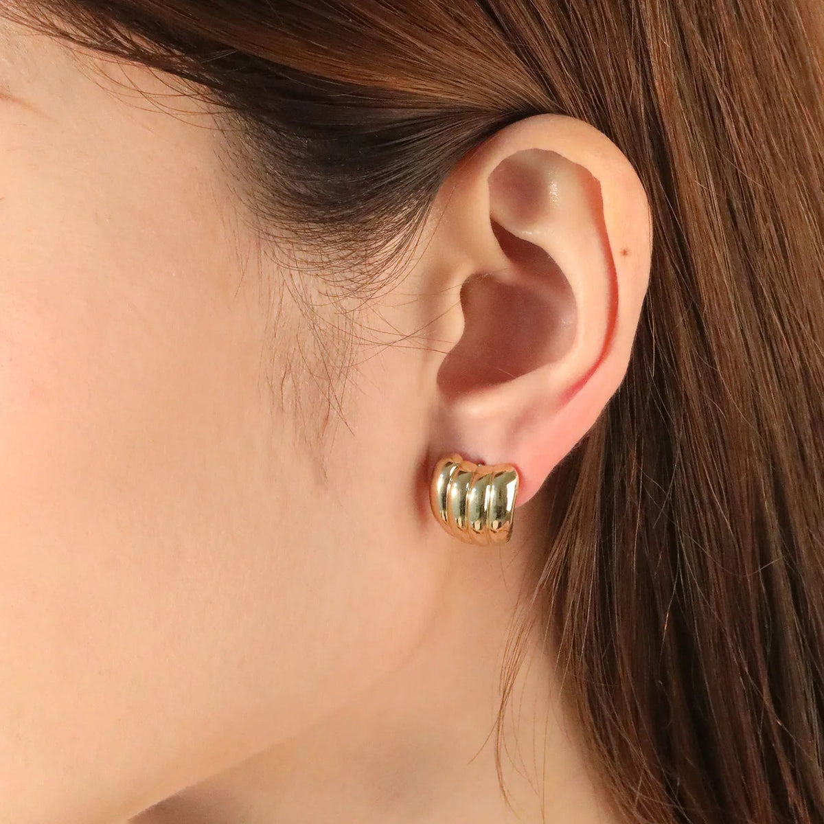 Ribbed Wide Huggie Hoop Earrings — on model