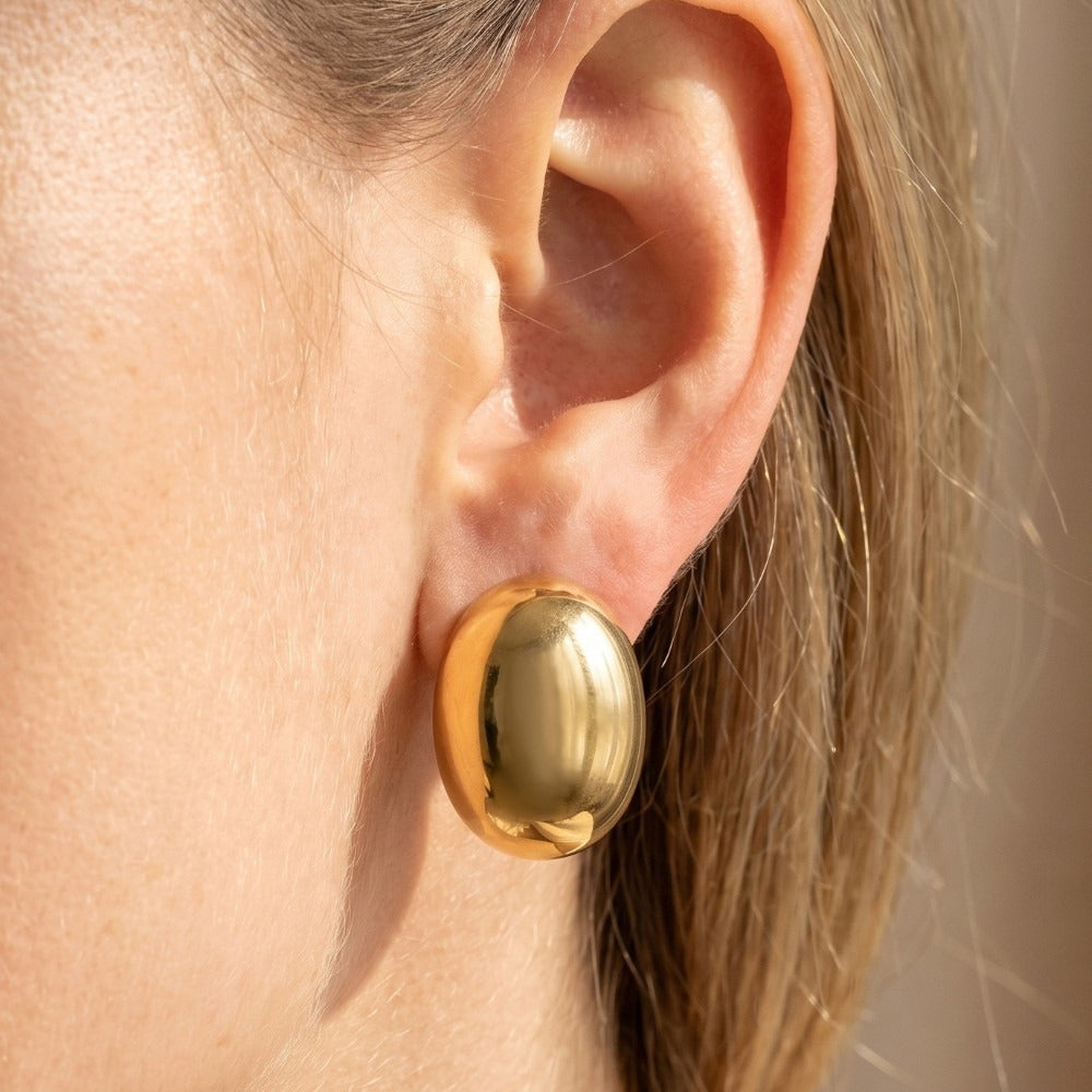 Large Puffy Oval Dome Stud Earrings — on model