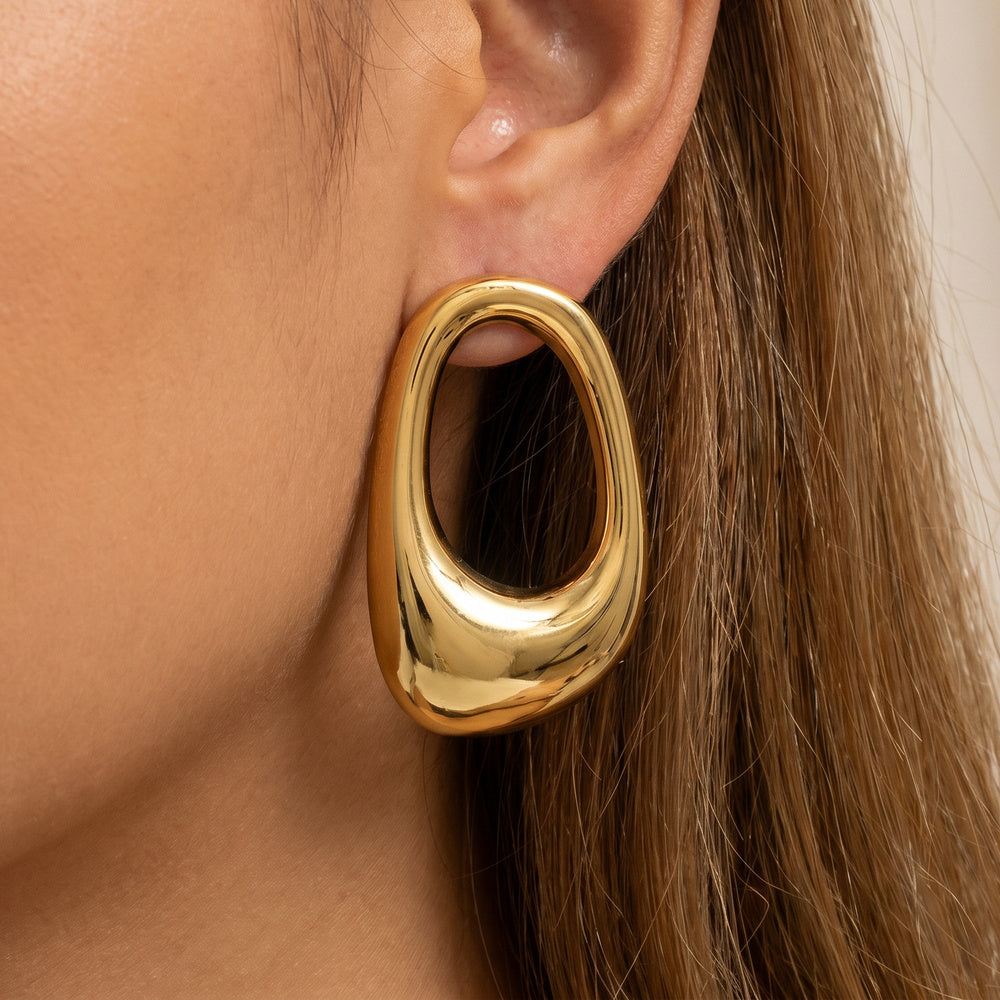 Chunky Puffed Oval Hoop Earrings — on model