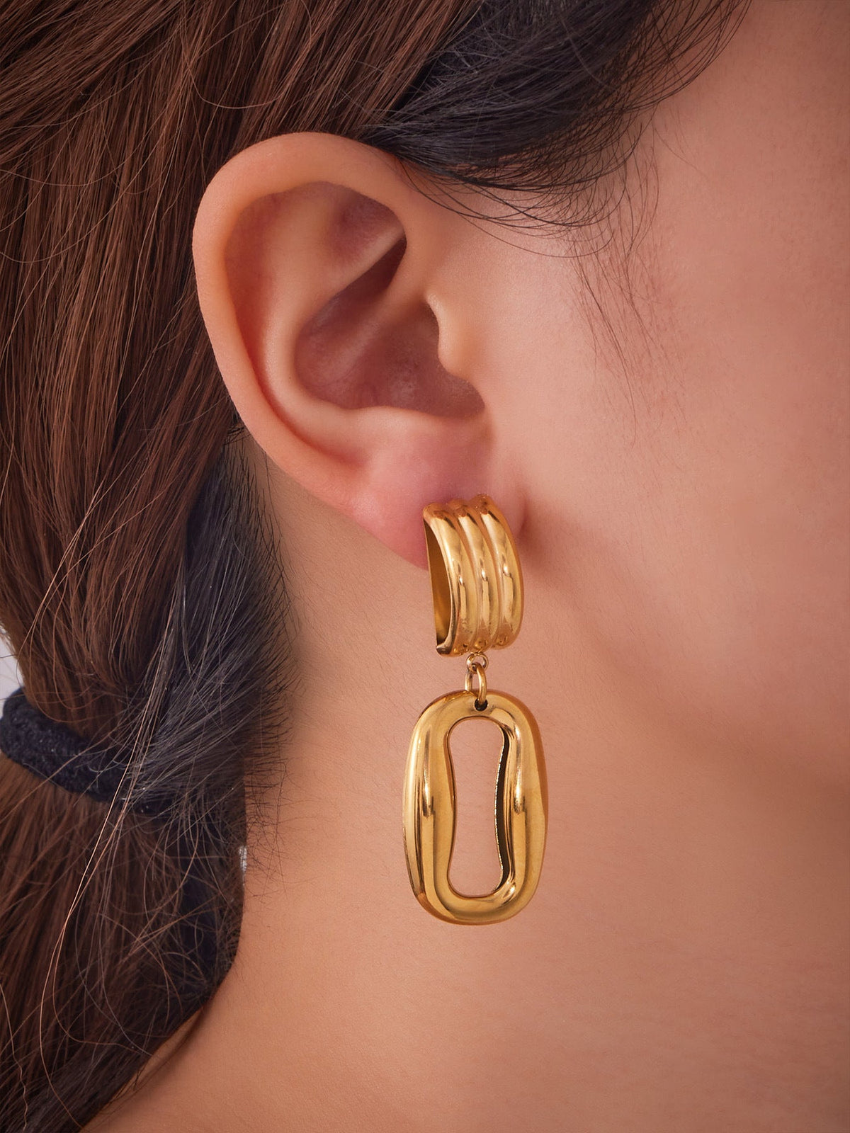 Hollow Door Knocker Earrings — on model