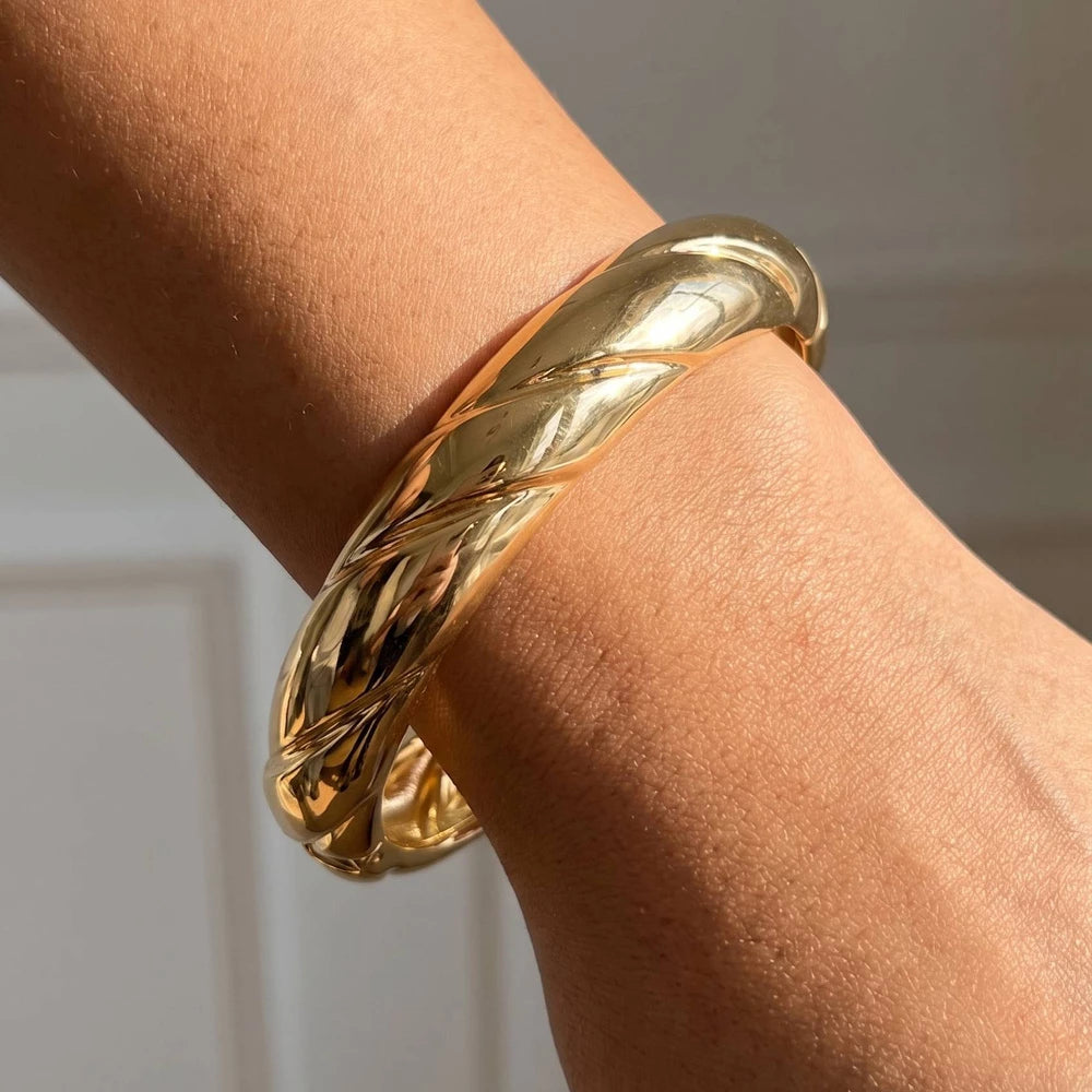 Twisted Dome Hinged Bangle Bracelet — Gold — supplier styling photograph